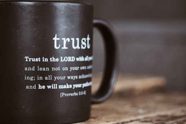 black mug with proverb from holy bible